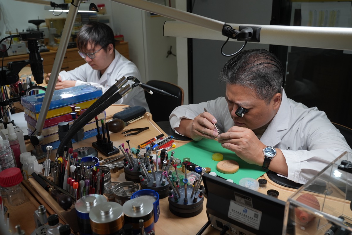 Master watchmaker Simon Leong servicing a luxury timepiece